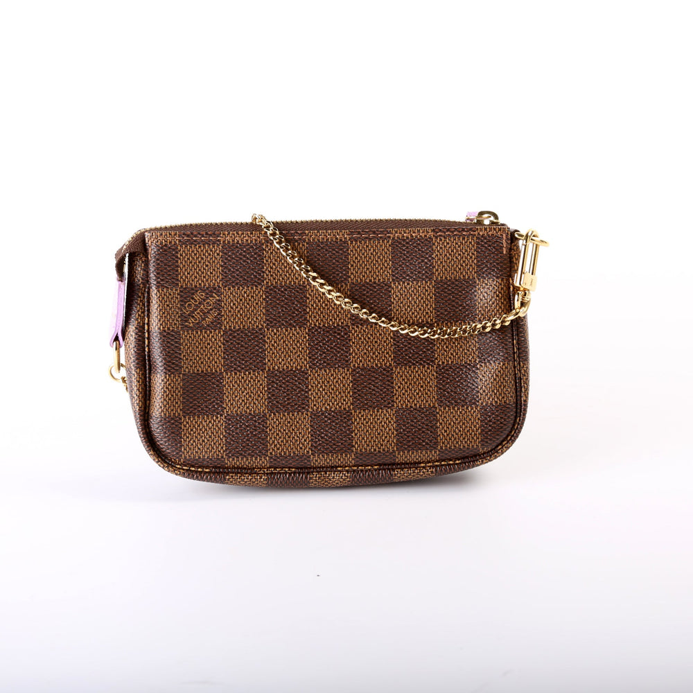 
                      
                        Pochette Accessories Mini Damier Ebene T&B
                      
                    