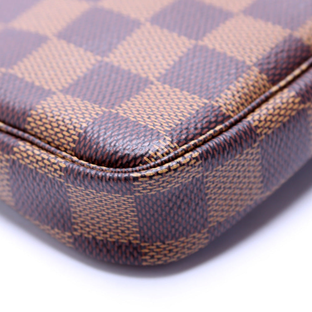 
                      
                        Pochette Accessories Mini Damier Ebene
                      
                    