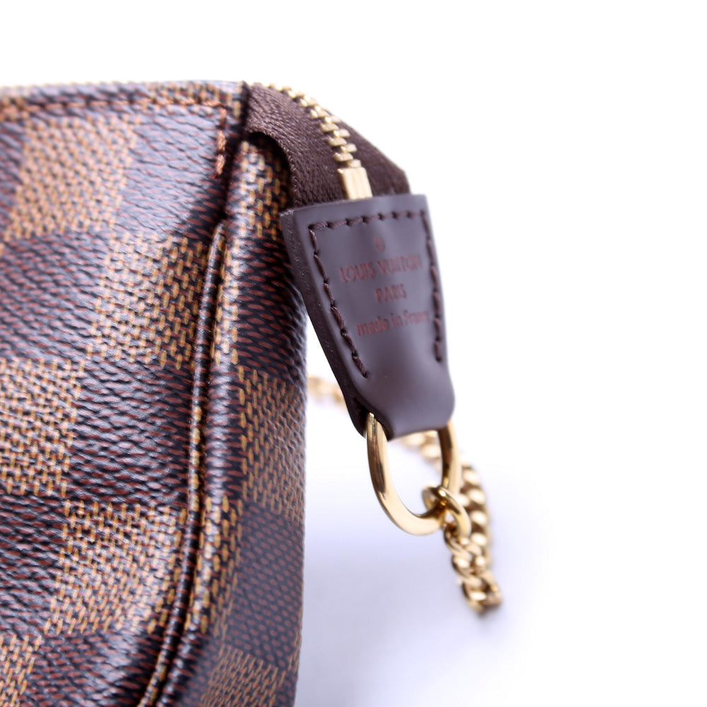 
                      
                        Pochette Accessories Mini Damier Ebene
                      
                    