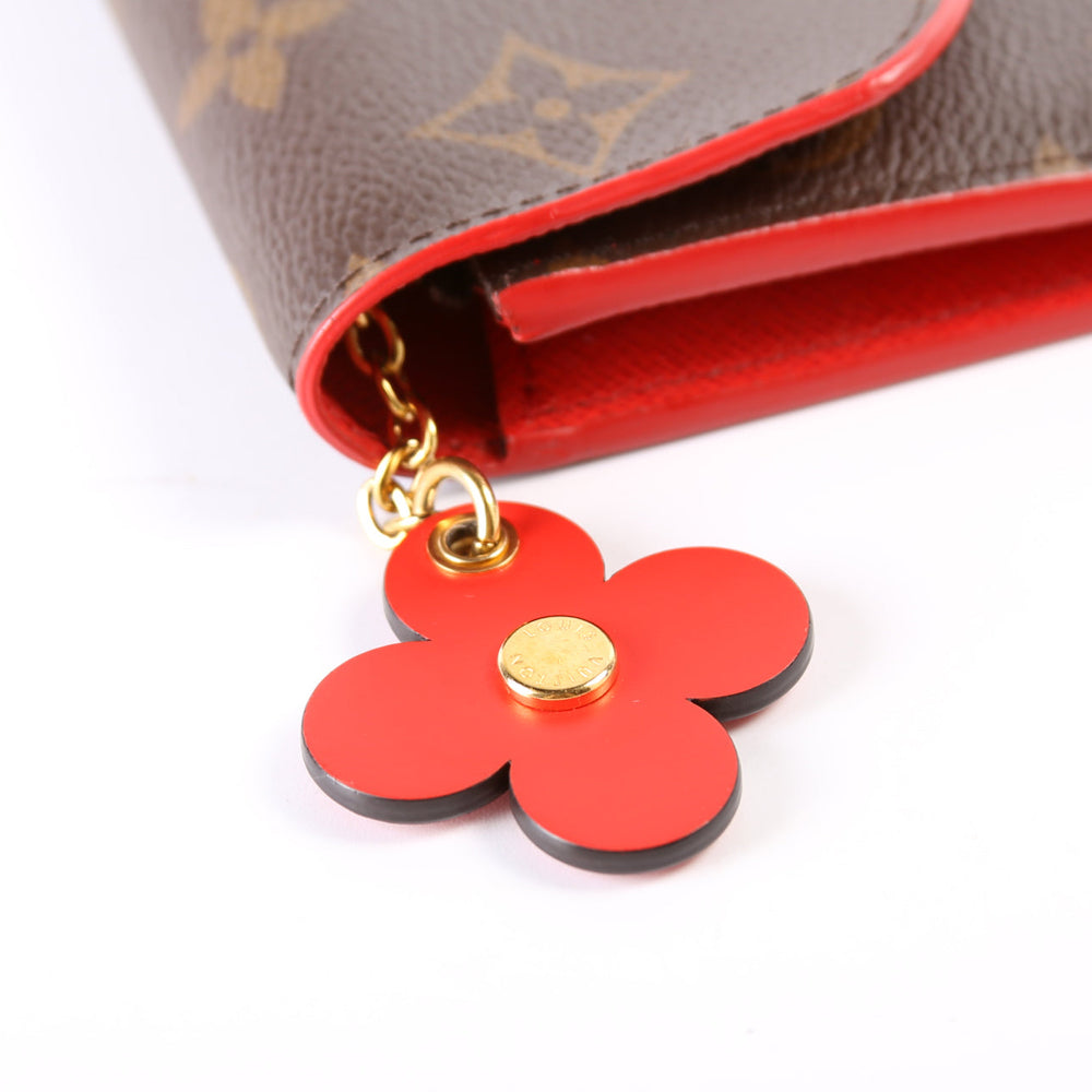 
                      
                        Emilie Wallet Flower
                      
                    