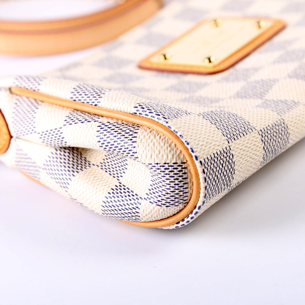 
                      
                        Eva Clutch Damier Azur
                      
                    