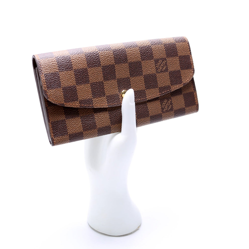 
                      
                        Emilie Wallet Damier Ebene
                      
                    