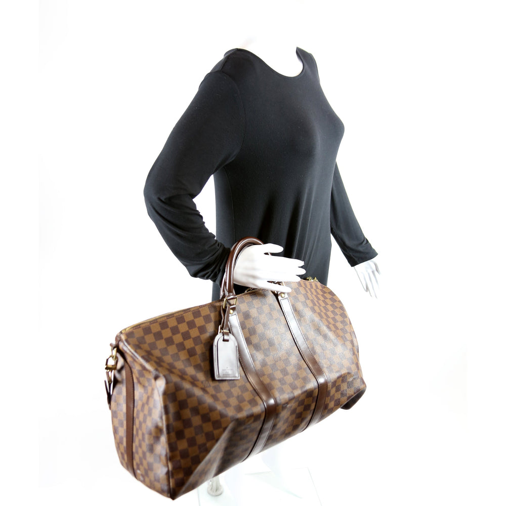 
                      
                        Keepall 55 Bandouliere Damier Ebene
                      
                    