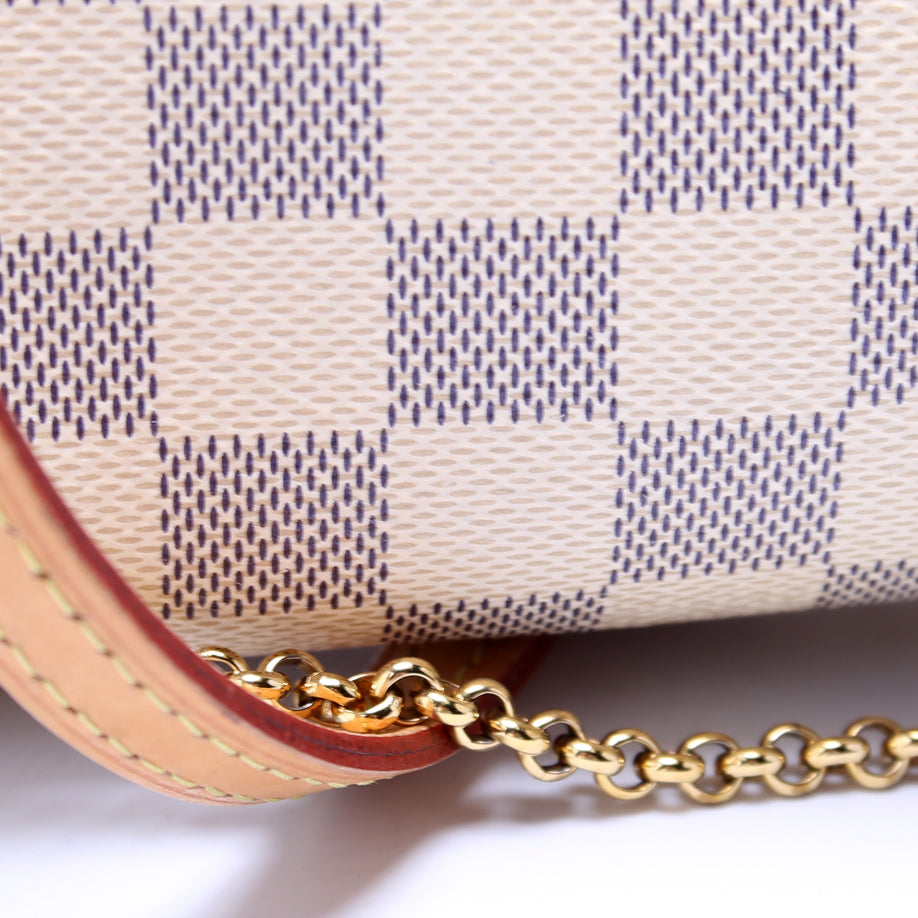 
                      
                        Eva Clutch Damier Azur
                      
                    